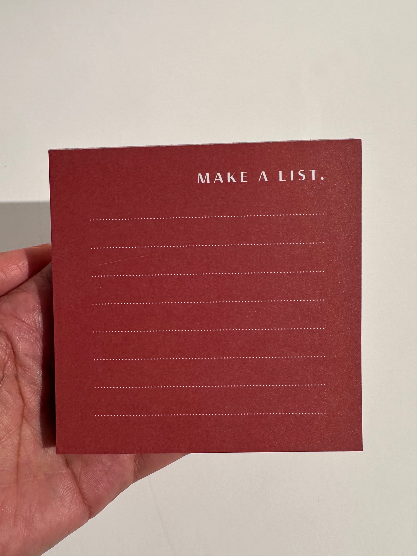 Garnet red color block notepad with 100 thick pages, front view
