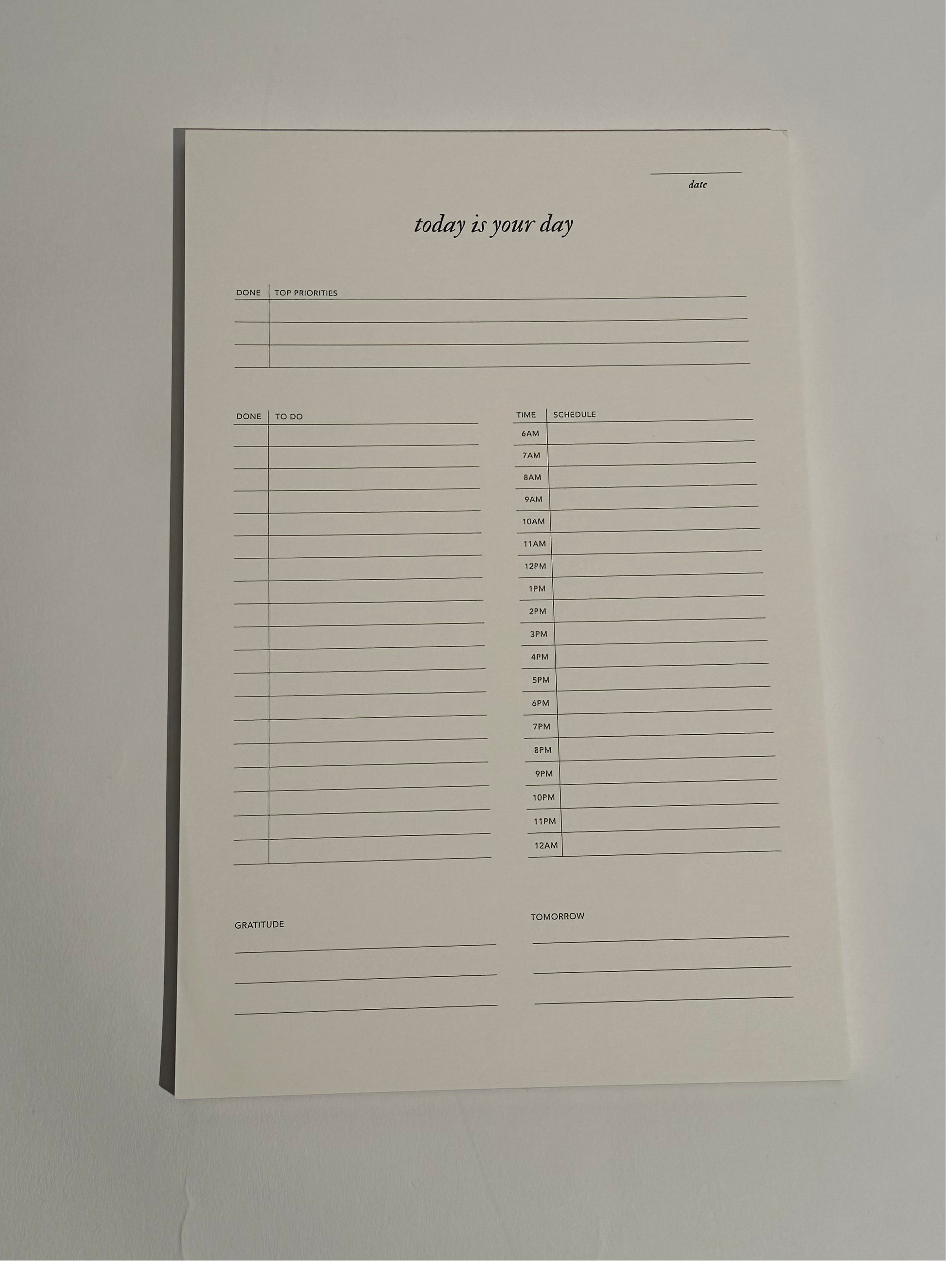A Today is Your Day Daily Notepad with 50 pages of cream paper, designed for goal-setting, task management, and inspiration, featuring an elegant design.