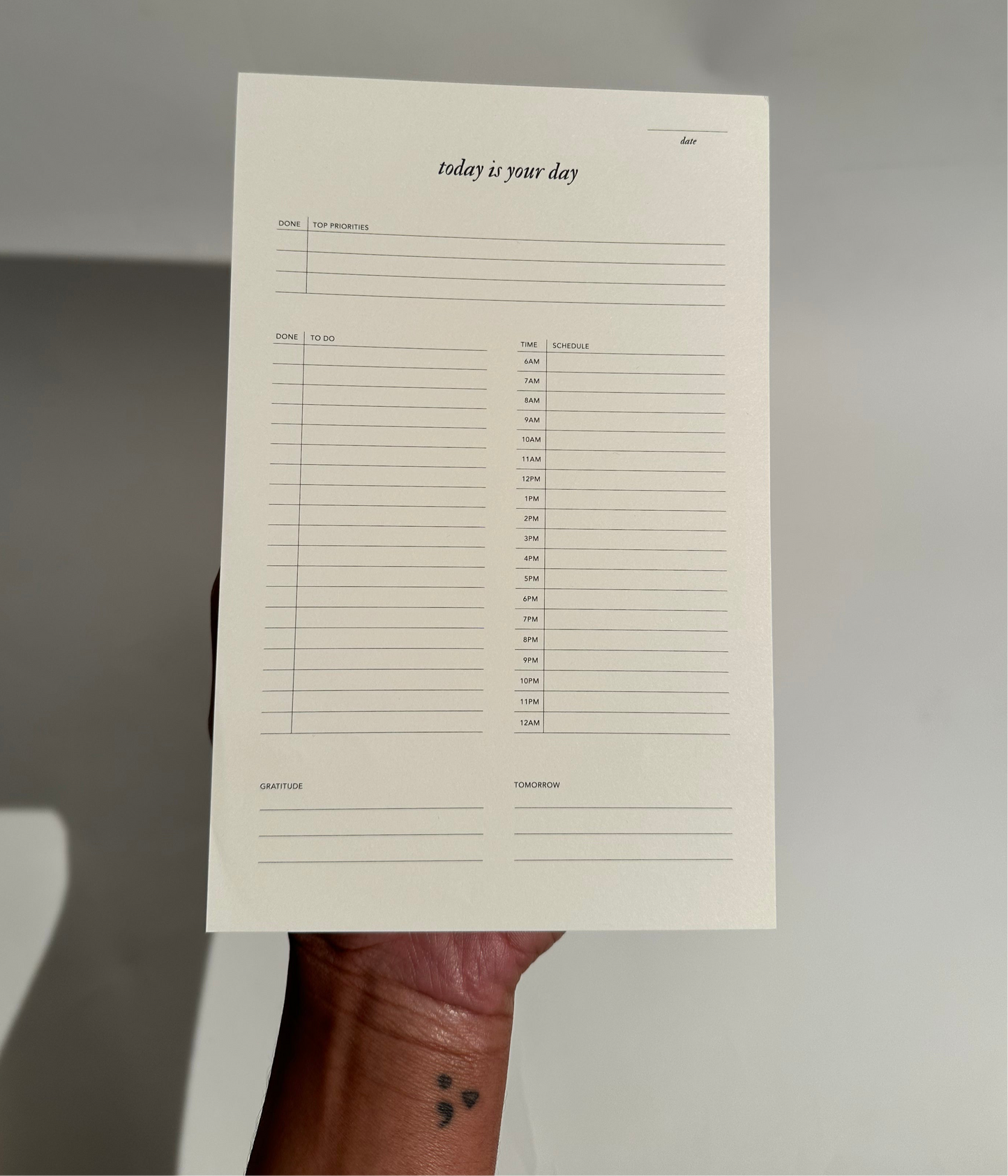 A Today is Your Day Daily Notepad with 50 pages of cream paper, designed for goal-setting, task management, and inspiration, featuring an elegant design.