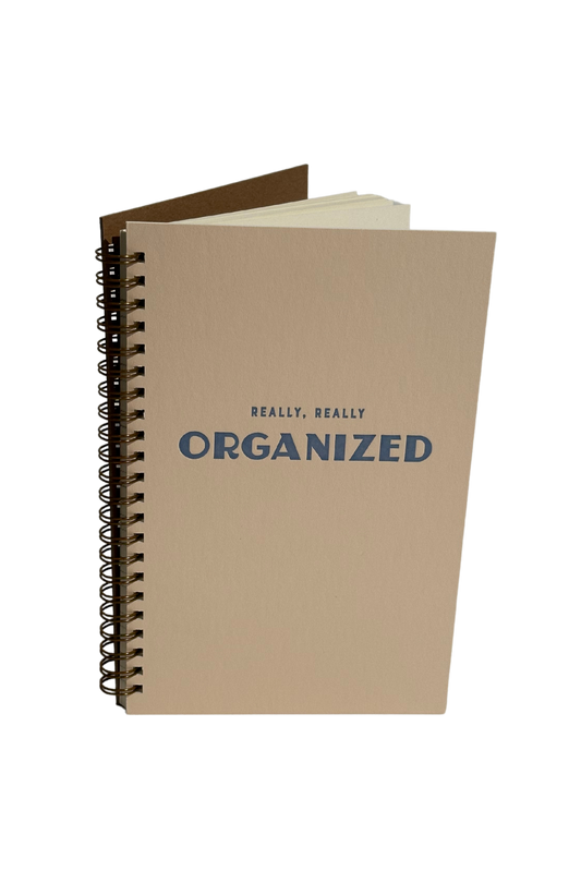 A Really Really Organized Undated Weekly Planner Journal with a French Vanilla cover, featuring scheduling, checklists, and lined journal pages for notes.