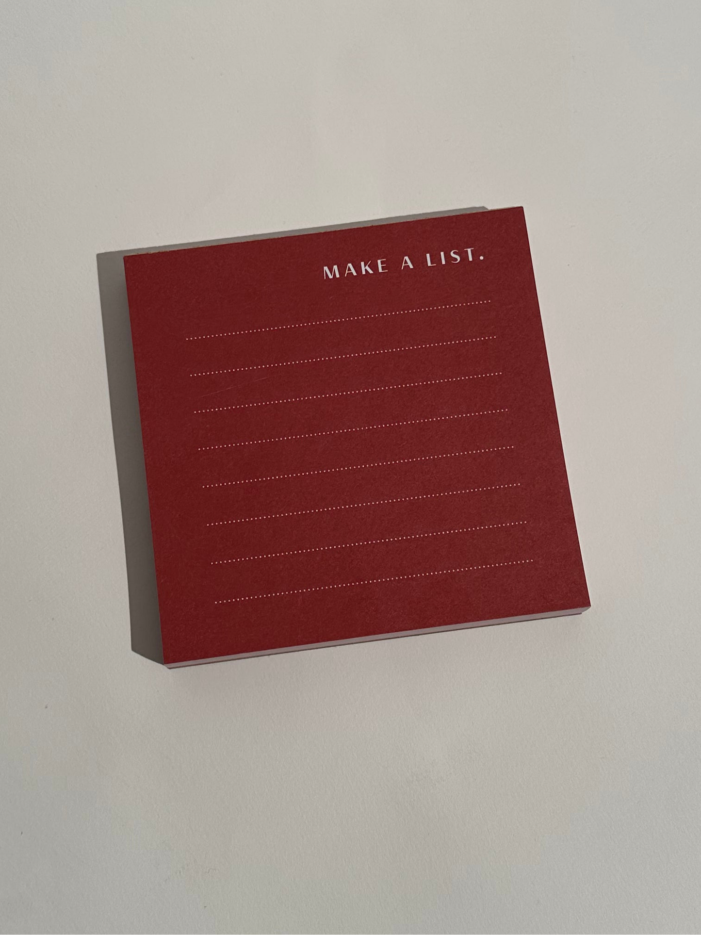 Garnet red color block notepad with 100 thick pages, front view